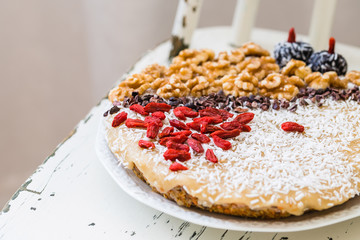 Raw vegan sweet carrot cake with walnuts, goji