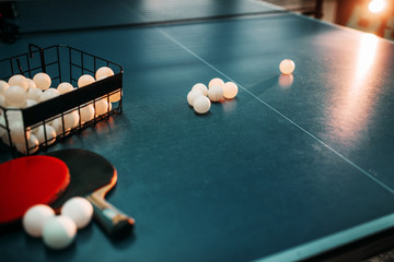 Ping pong table, rackets and basket with balls