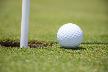 Golf Ball Near Hole

