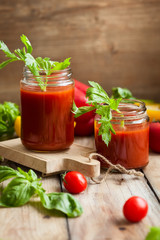 Spicy tomato drink in jars