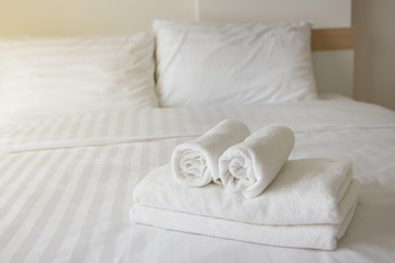 Fototapeta na wymiar Towel on the bed in the hotel