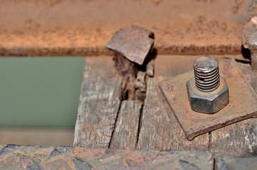 Big rusty metal nut locked with rust and corrosion bolt, Industrial bolt and nut with shallow focus
