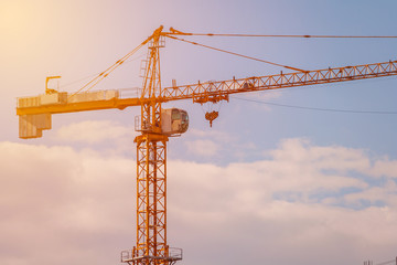 Tower crane illuminated by sun (toned)