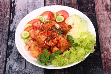 Spicy crispy deep-fried chicken salad.