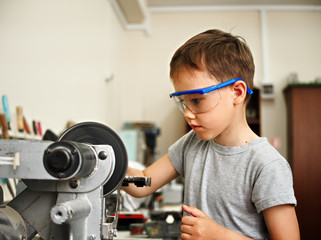 A boy makes a car model
