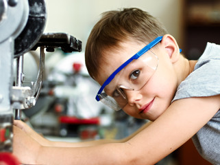 A boy makes a car model
