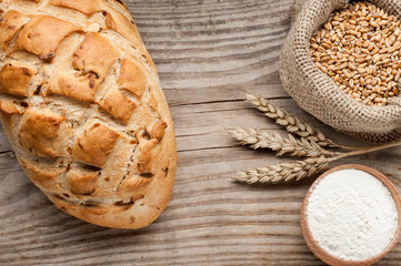 loaf of bread on wooden table