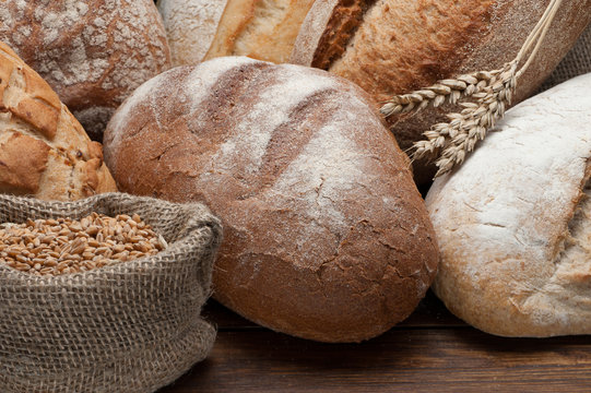 Bread arranged on wooden table