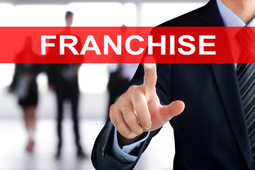Businessman hand touching FRANCHISE tab on virtual screen