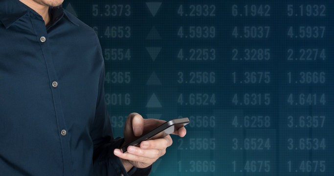 Businessman using smart phone on Stock market financial analysis indicator background