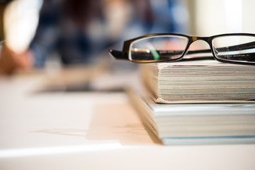 eyeglasses on the book stack. the concept of education