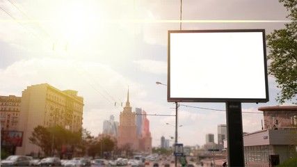 a Billboard With a Blank Screen on a Busy Street