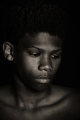 Moody monochrome portrait of a young African boy