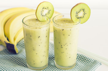 Fototapeta na wymiar Banana smoothie with kiwi. Healthy food concept