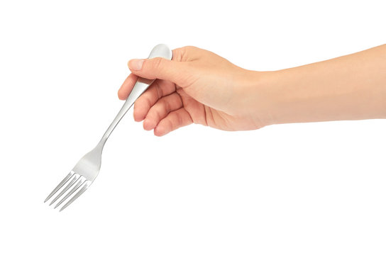 Female hands hold a fork. Isolated on white background