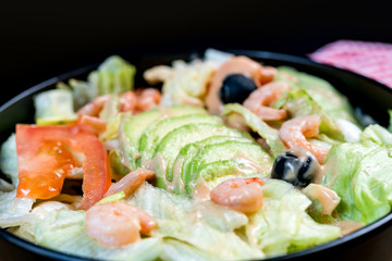 Delicious fresh salad and olive oil
