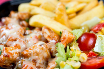 Fresh chicken steak with tomatoes and french fries