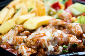 Fresh chicken steak with tomatoes and french fries