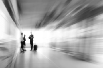 White gray business abstract background with people standing in the corridor, zoom effect