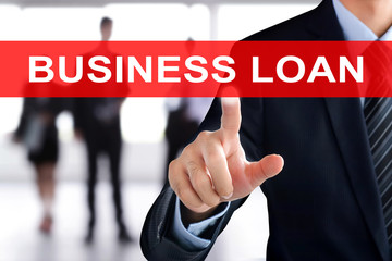 Businessman hand touching BUSINESS LOAN tab on virtual screen