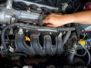 Car mechanic working in auto repair service