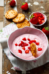 Strawberry cheesecake dip with cookies .