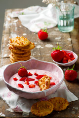 Strawberry cheesecake dip with cookies .