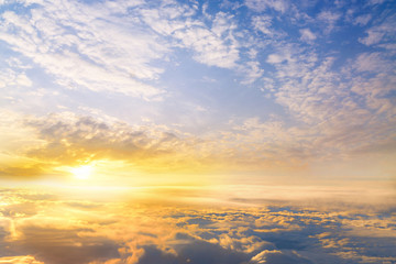 sunset clouds sky skyscape. view from the window of an airplane flying in the clouds, top view clouds like  the sea of clouds sky background