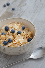 close up view of bowl full of muesli on color back