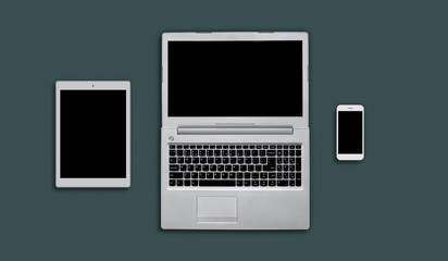 Layout of modern gadgets for web design. Top view of electonic devices: tablet, laptop computer and mobile phone. Office workplace with copy space for your text or hearder. Technology concept