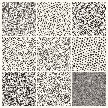 Collection of monochrome memphis seamless patterns.