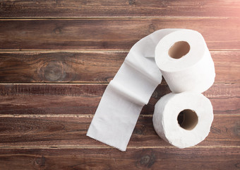 roll of toilet paper on a wooden background