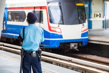 Security guard at the sky train station.