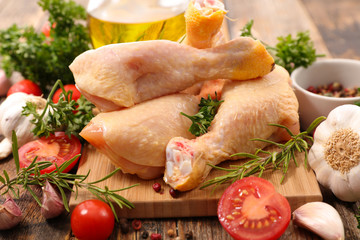 raw chicken leg with ingredients