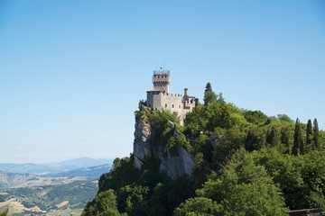 Fototapeta na wymiar Aerial view of Cesta and The Montale on the cliff edge on Mount Titano. Second Tower. Republic of San Marino inside Italy.