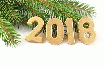 2018 year golden figures and spruce branch