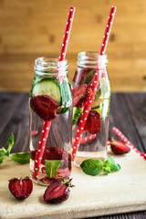 Detox water infused with fruits. Summer water fruit on rustic background