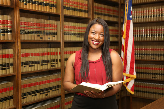 Portrait of attractive young African American female lawyer, law office
