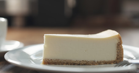 cheesecake with espresso on table
