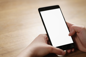 female teen hand holding smartphone with blank white screen