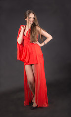Slim girl in a red dress