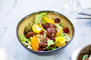 The chicken liver salad tomato and physalis is in the bowl.
