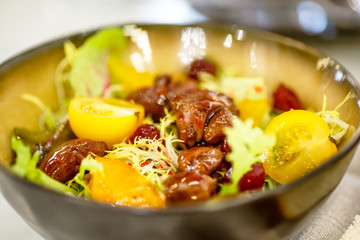 The chicken liver salad tomato and physalis is in the bowl.