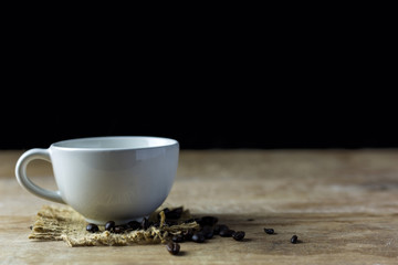 Cup of coffee on wood