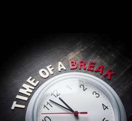 Wall clock and wording " TIME BREAK " on wooden with with Text Space