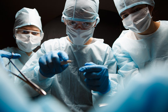 Photo of doctors with instruments