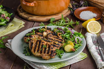Grilled pork chops with lettuce salad