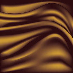 Soft golden silky fabric. Silk waves. Background.