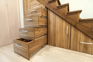 Blackout curtains Stairs Modern architecture interior with luxury hallway with glossy wooden stairs in modern storey house. Custom built pullout cabinets on glides in slots under stairs