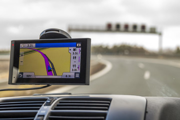 Close-up of gps navigation system device in travelling car